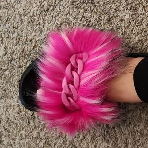 Pink and black stylish slippers or slides.